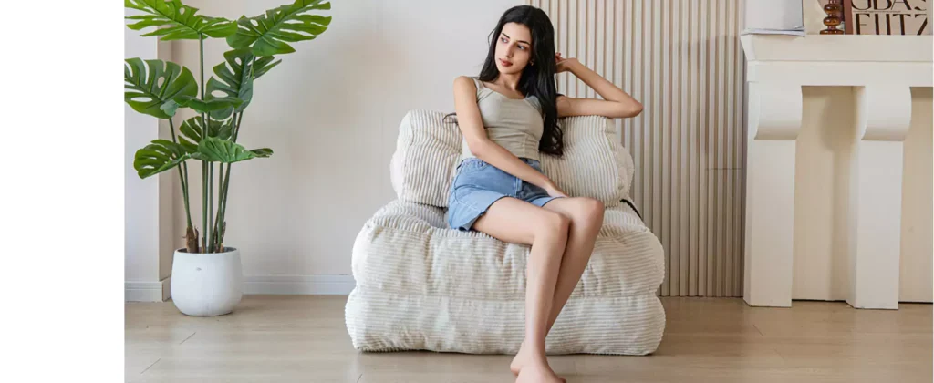 Best Foldable Furniture for Small Spaces on Amazon in 2025 1 Foldable Furniture for Small Spaces on Amazon in 2025 - A girl is siting on MAXYOYO Folding Sofa Bed